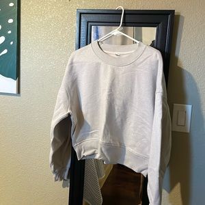Lululemon shimmer lightweight sweater in size 8. Cream color with gold shimmer.